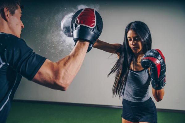 woman boxing gloves, woman boxing shorts with punching bags