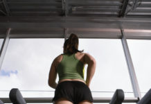Young Woman Jogging on Treadmill